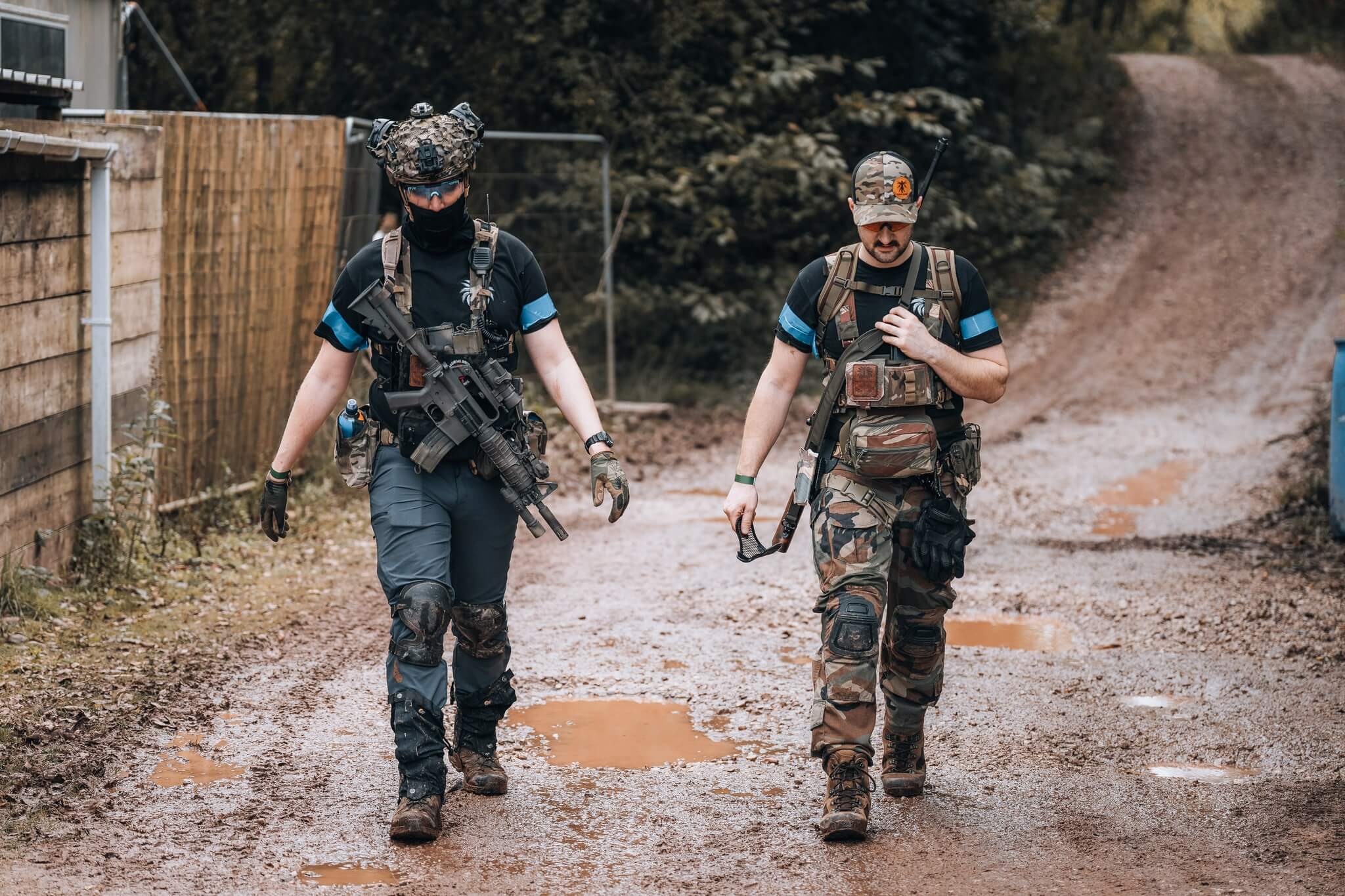 Airsoft duo from NemTac and Tropic Thunder walking to the field in military gear